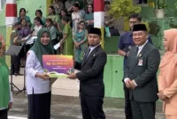 Wali Kota Parepare, Tasming Hamid bertindak sebagai pembina upacara dalam peringatan Hari Amal Bhakti (HAB) ke-80 Kementerian Agama Republik Indonesia tingkat Kota Parepare di halaman Kantor Kementerian Agama Kota Parepare di Jl Jendral Sudirman, Kelurahan Cappa Galung, Kecamatan Bacukiki Barat, Kota Parepare, Sulsel, Jumat (3/1/2026). (Foto: ist).